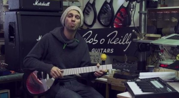 a man playing an electric guitar