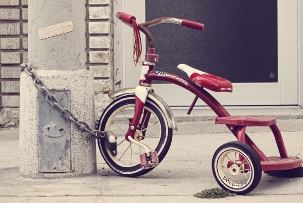 kids bike chained to a lampost