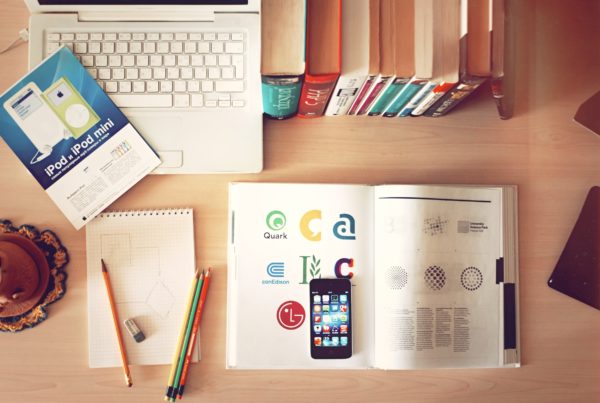 laptop, books, phone and pencils