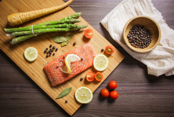salmon and veg on a chopping board