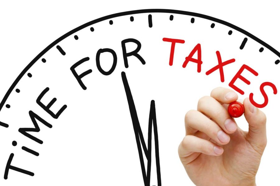 drawing of a clock with 'time for taxes' on it