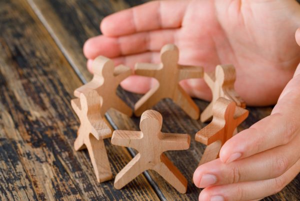 wooden stickmen in a circle