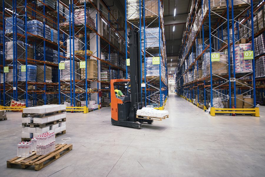 Industrial building large warehouse interior with forklift